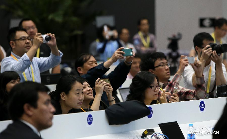 Journalists work at the media center of the fourth summit of the Conference on Interaction and Confidence Building Measures in Asia (CICA) in east China's Shanghai, May 21, 2014. The fourth CICA summit began in Shanghai on Wednesday morning. (Xinhua/Pei Xin) 