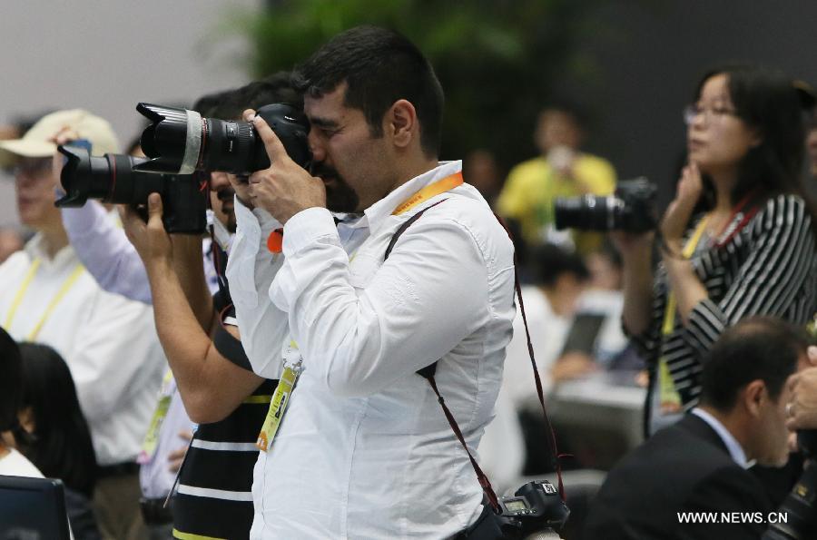 Journalists work at the media center of the fourth summit of the Conference on Interaction and Confidence Building Measures in Asia (CICA) in east China's Shanghai, May 21, 2014. The fourth CICA summit began in Shanghai on Wednesday morning. (Xinhua/Chen Fei) 