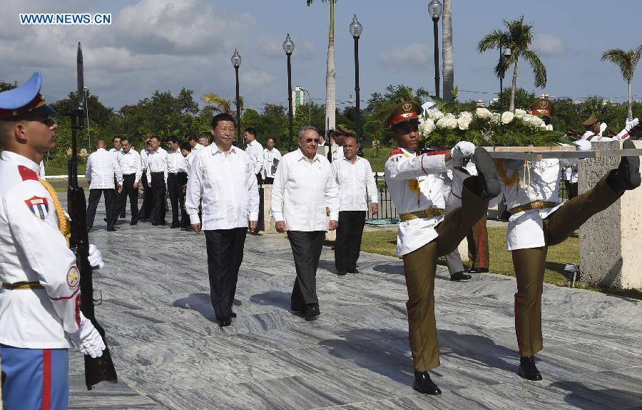 Chinese President Xi Jinping (2nd L front), with the accompany of Cuban leader Raul Castro, attend a wreath-laying ceremony at the tomb of Jose Marti, a Cuban national hero and an important figure in Latin American literature, at Santiago de Cuba, the Cuban "Heroic City," July 23, 2014. Xi visited Santiago de Cuba, the second largest city of Cuba, on Wednesday. (Xinhua/Ma Zhancheng)