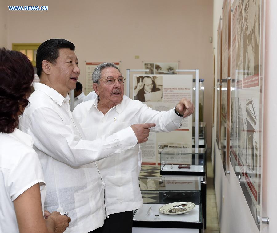 Chinese President Xi Jinping (2nd L), with the accompany of Cuban leader Raul Castro (1st R), visits Moncada Barracks, where former Cuban leader Fidel Castro launched a failed assault on July 26, 1953, at Santiago de Cuba, the Cuban "Heroic City," July 23, 2014. Xi visited Santiago de Cuba, the second largest city of Cuba, on Wednesday. (Xinhua/Lan Hongguang)