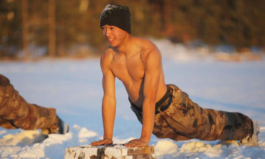 Shirtless frontier soldiers take training in freezing cold