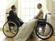 Wedding dress photos of an amputee couple