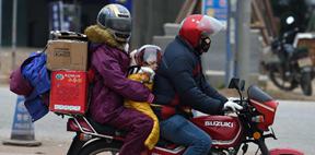 Migrant workers ride motorcycles home 