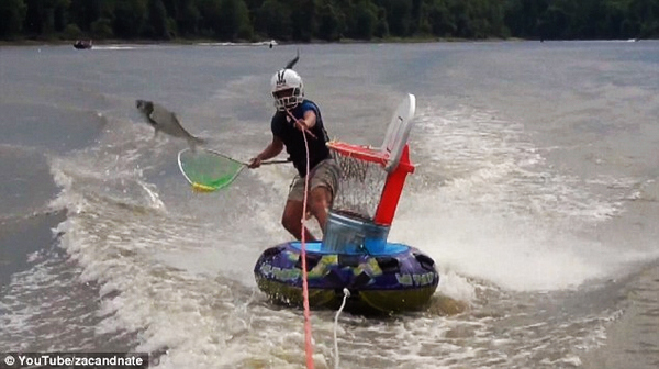 Wakeboarders go carp fishing with nets and a mini-basketball hoop