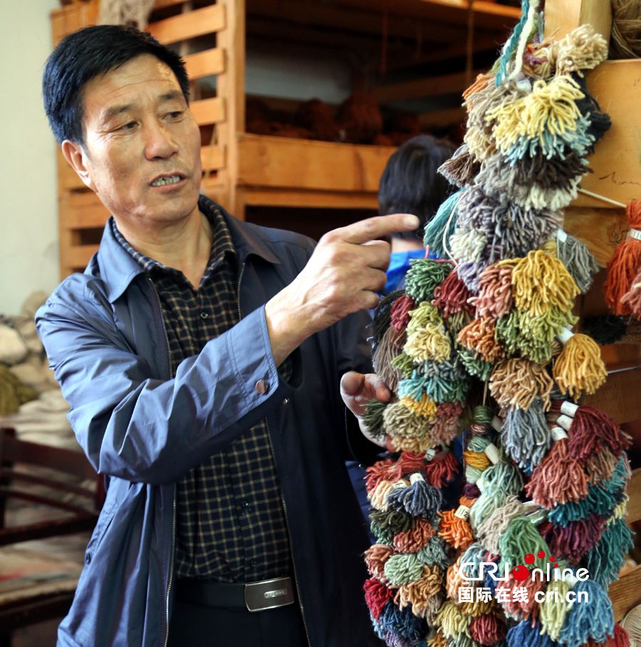 Legend on fingertip: the birth of a Tibetan carpet