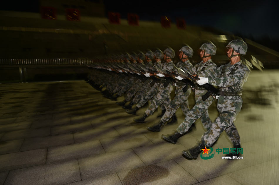 Chinese soldiers conduct training at night for V-Day parade