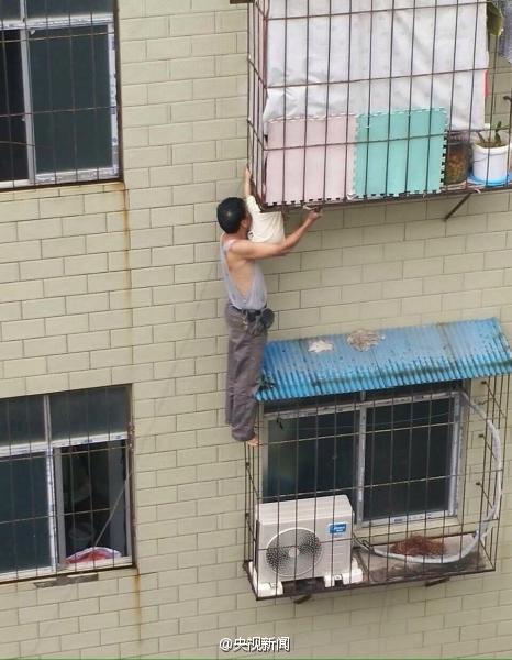 Man saved baby stuck in  window rails on fourth floor