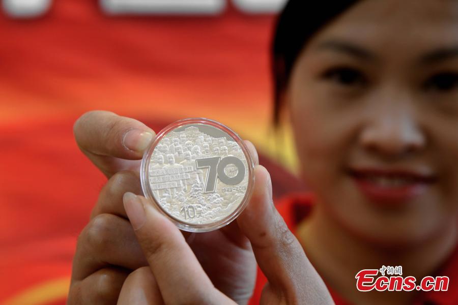 Commemorative coins for war anniversary debut in C China city