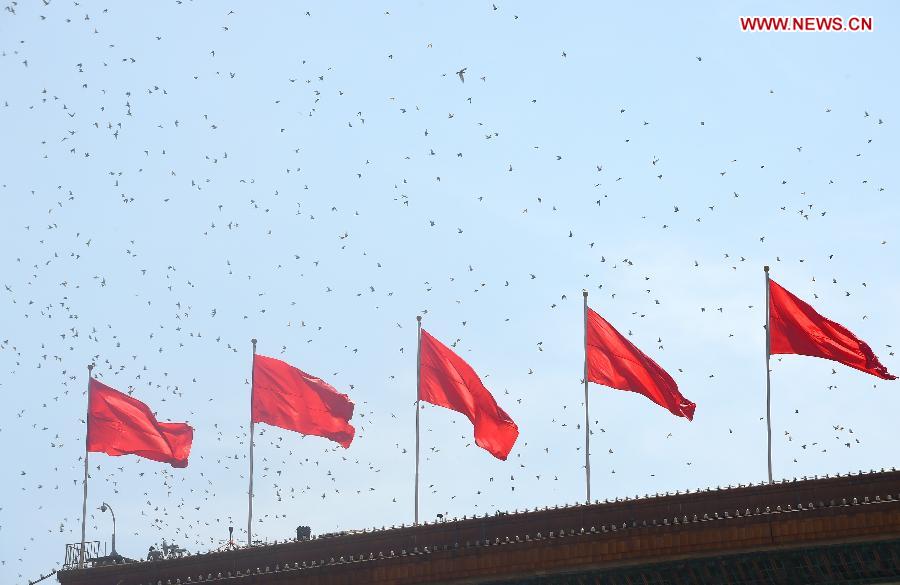 Hundreds and thousands of white doves are released, marking the end of the grand V-Day parade