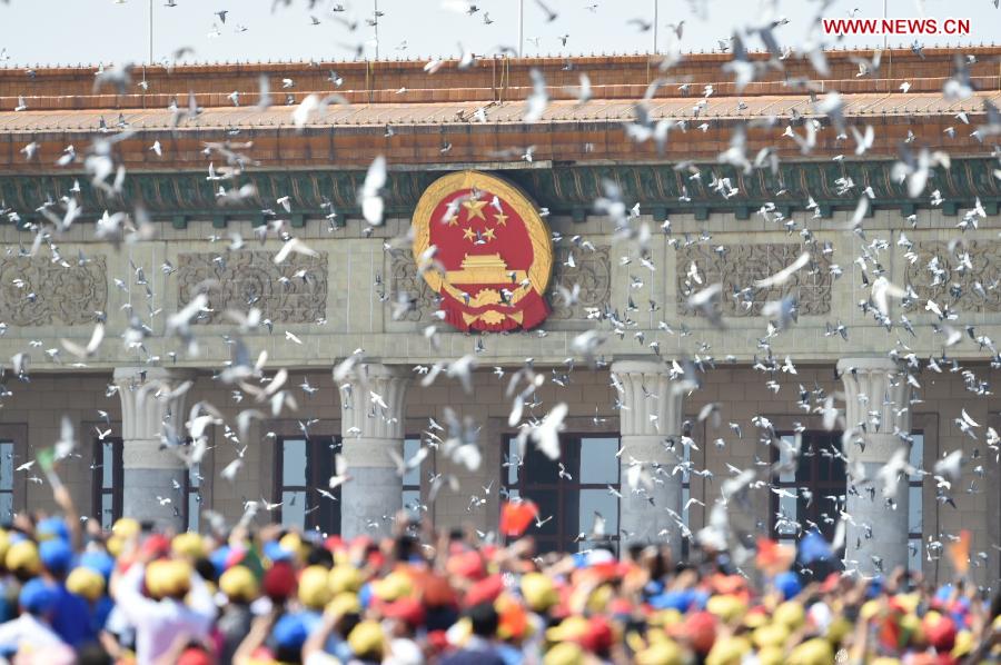 Hundreds and thousands of white doves are released, marking the end of the grand V-Day parade