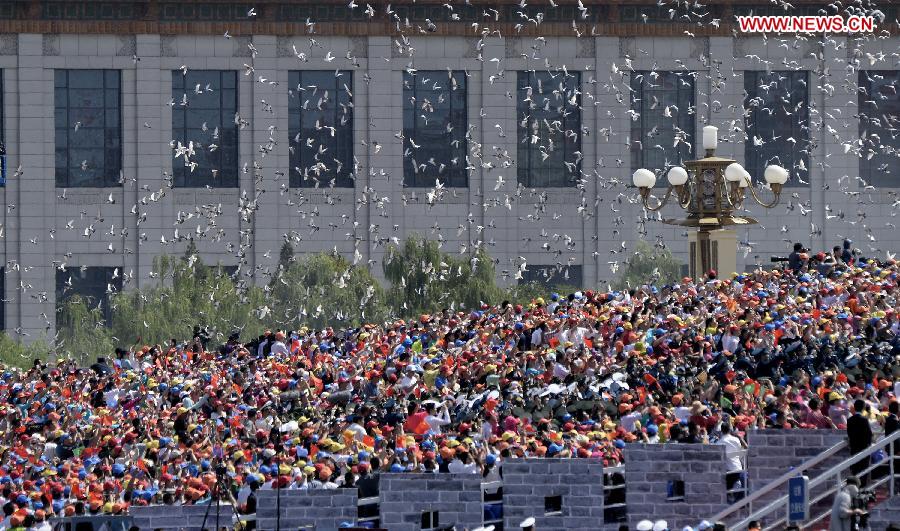 Hundreds and thousands of white doves are released, marking the end of the grand V-Day parade