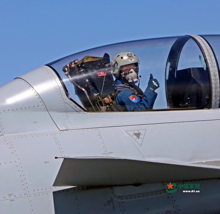 Pilots give thumbs up in fighter during V-day parade