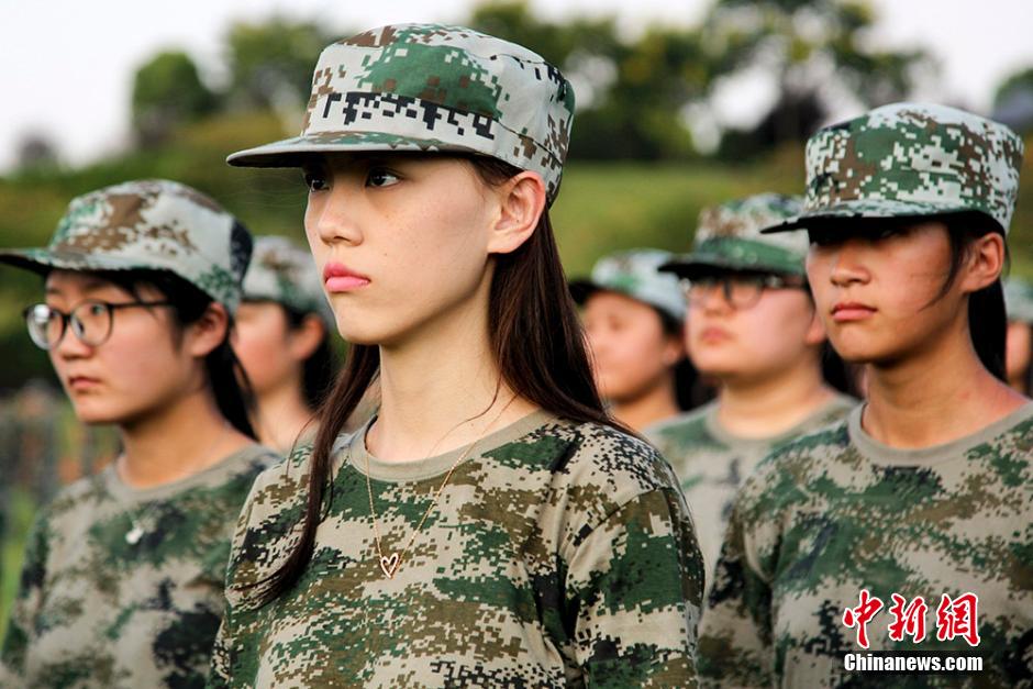 Charming girls attend military training