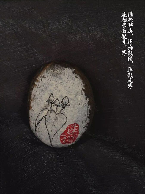 Doctor draws traditional Chinese medicines on stones