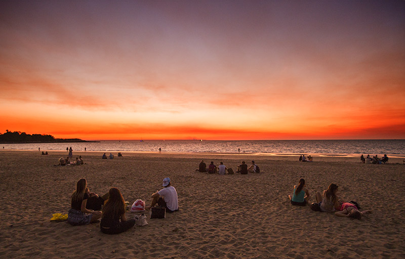 Watching a red sunset over the horizon: Mindil Beach Sunset Market in Australia