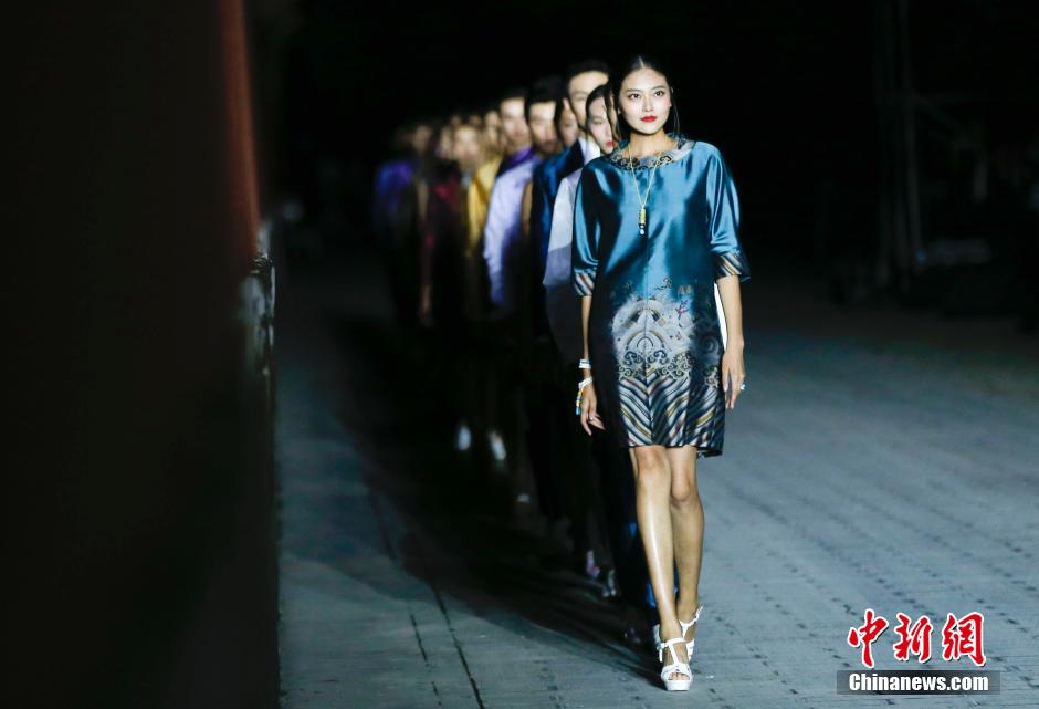 Fashion show staged in Forbidden City at night