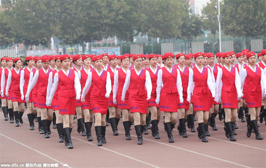Gorgeous stewardesses-to-be attend military training