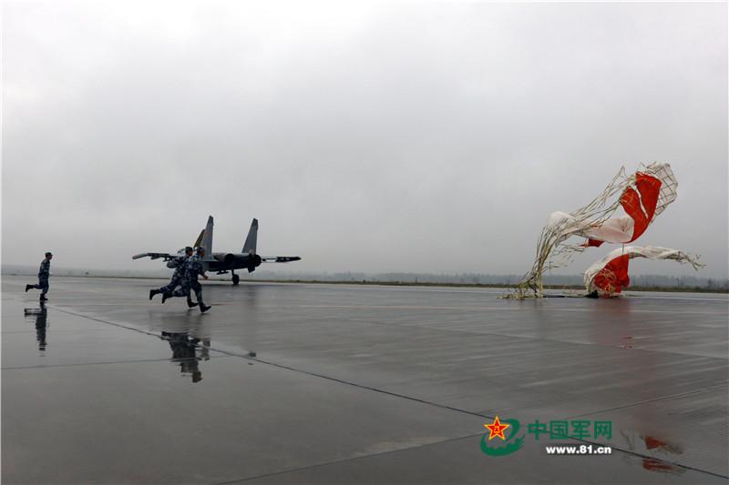 J11 fighters conduct drill in rain