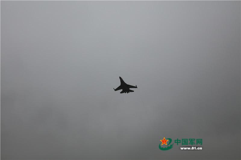 J11 fighters conduct drill in rain