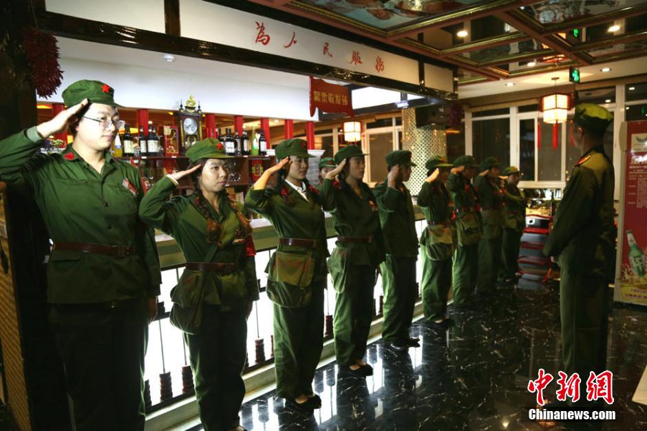 Waiters, waitresses dressed as Red Guards in restaurant in NW China
