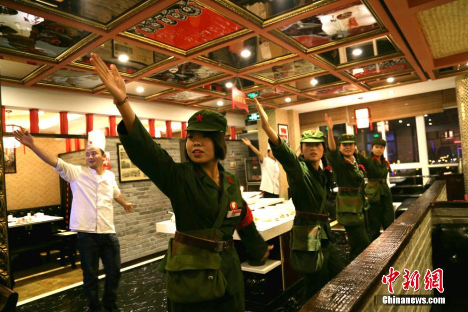 Waiters, waitresses dressed as Red Guards in restaurant in NW China