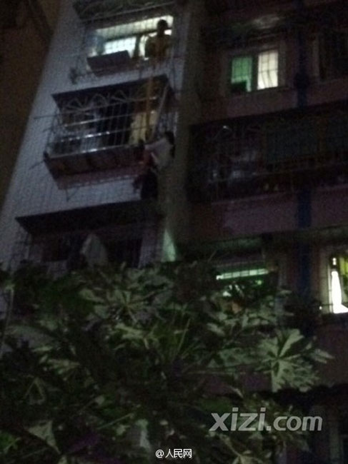 Woman saves baby stuck in window rails on fifth floor
