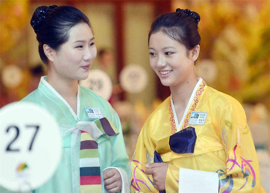 Beautiful DPRK waitresses in Korean families reunion dinner