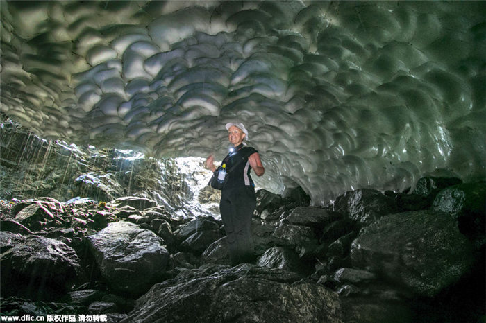 Inside the Georgian Ice Cave with water melting down like rain