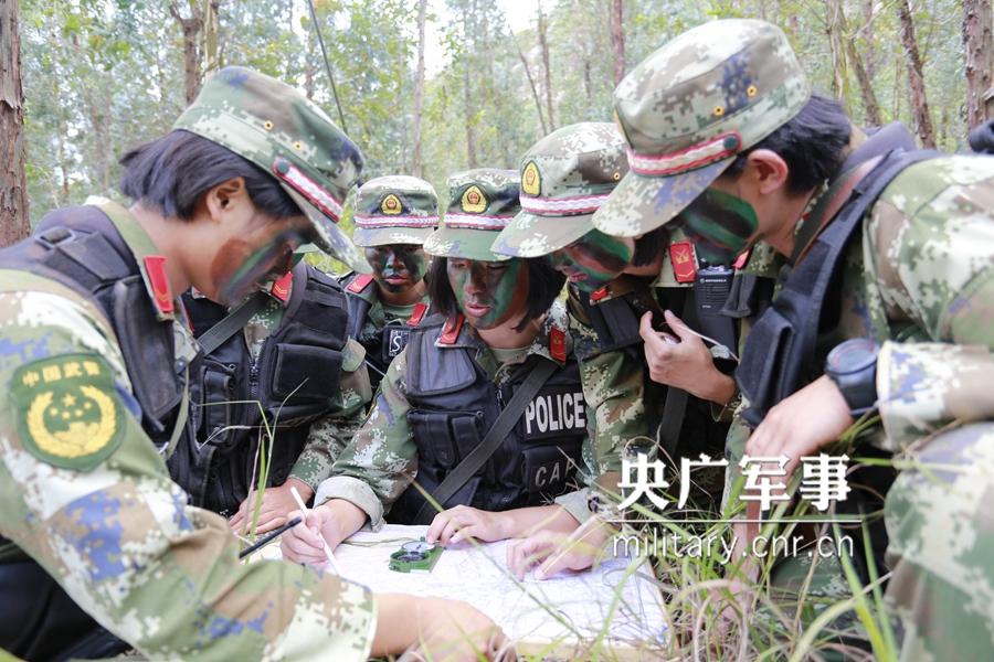 Female soldier of armed police force climbs cliff barehanded