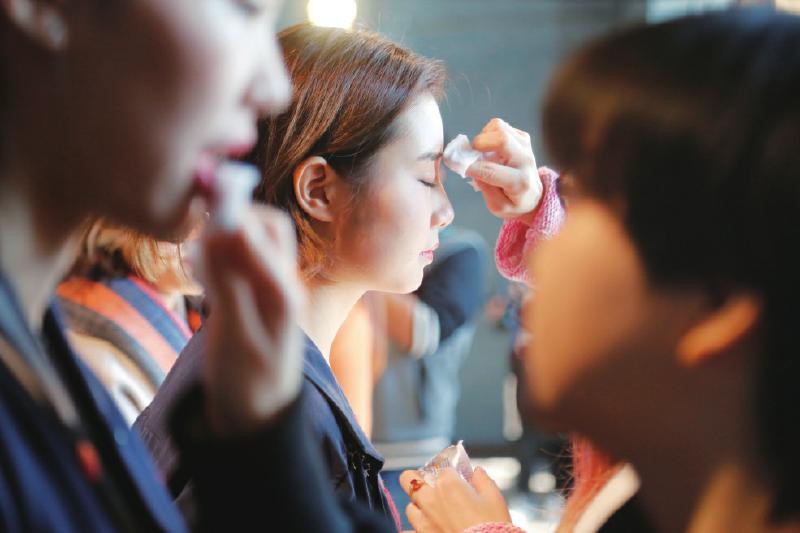 Girls remove make-up during Miss University Contest