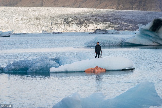 Artist creates stunning portraits of partially submerged women on melting icebergs 