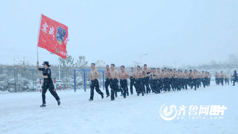 College students brave snow shirtless for training