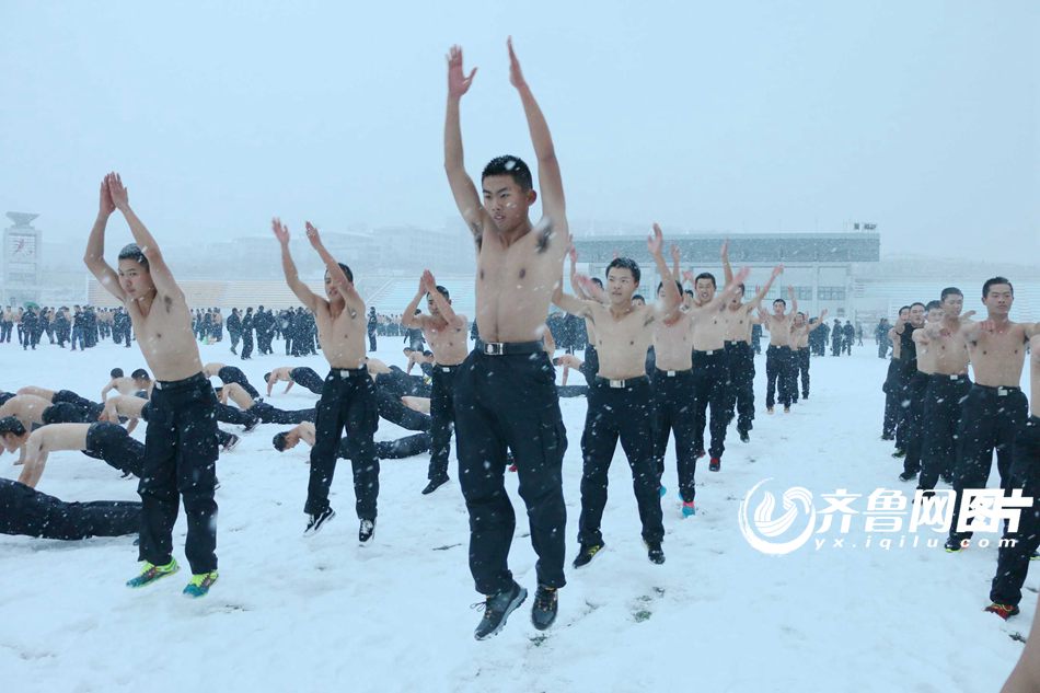 College students brave snow shirtless for training