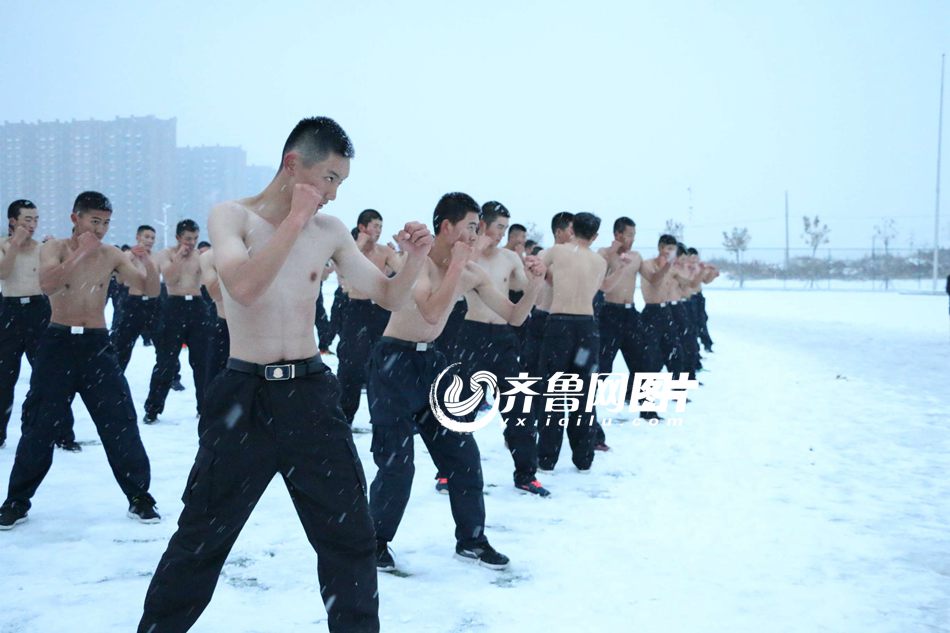 College students brave snow shirtless for training