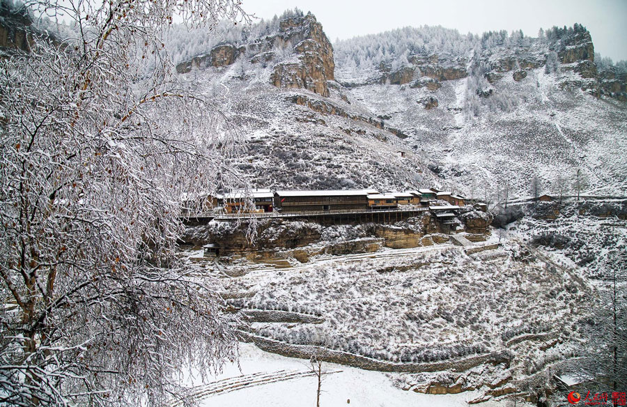 Hanging village on cliff after snow 