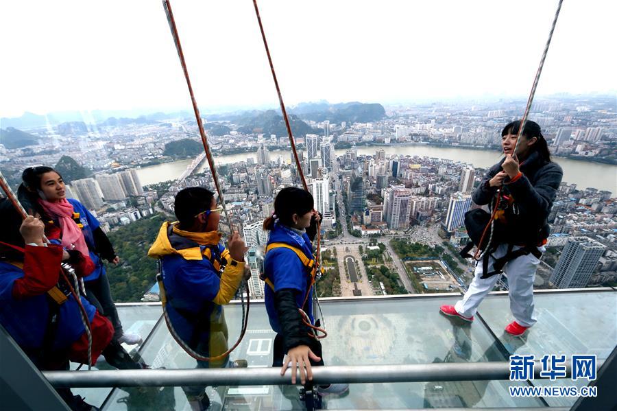 Glass skywalk built on top of skyscraper in S China