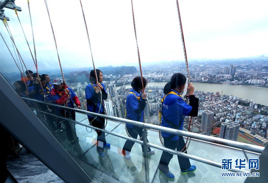 Glass skywalk built on top of skyscraper in S China