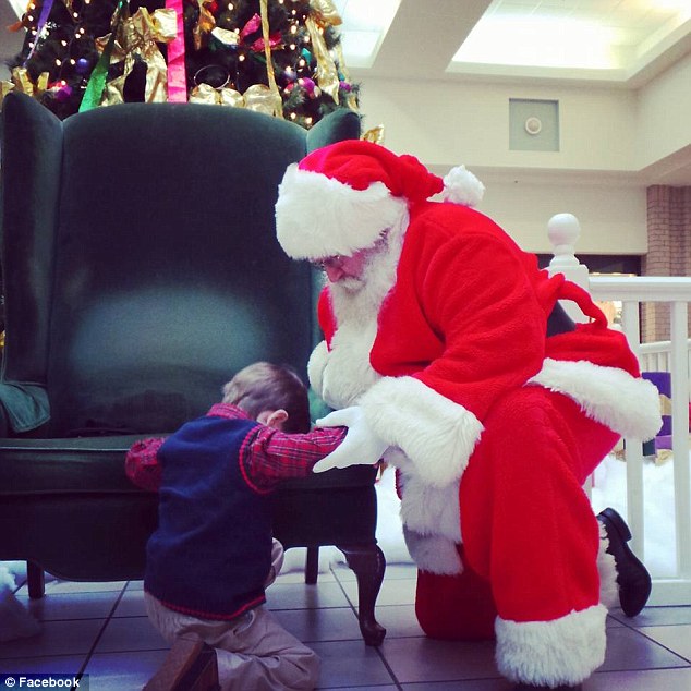 Incredible moment a little boy asks Santa to pray with him for a baby on life support