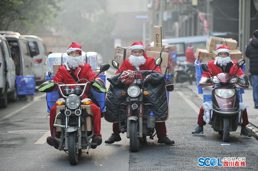 Couriers dressed as Santa Claus in Chengdu
