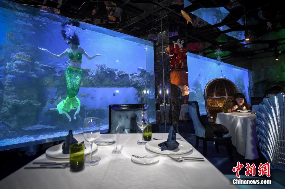 Customers dine with 'mermaids' in ocean-themed restaurant