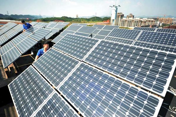 China to cut on-grid tariffs for solar, wind power: State planner