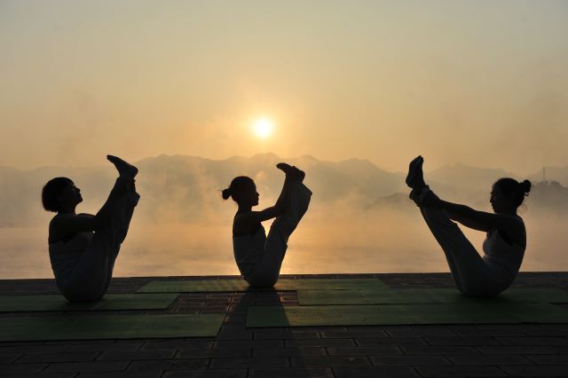 Yoga in front of the Three Gorges Dam