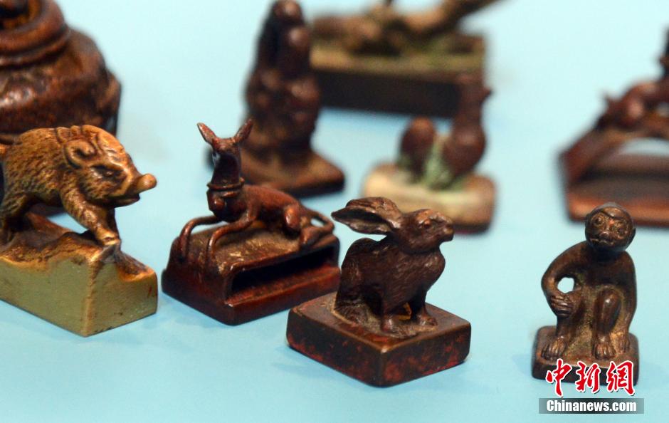 Copper Chinese Zodiac stamps shown in SE China