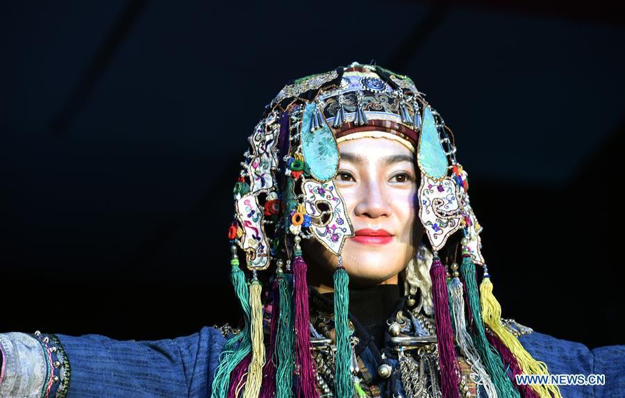 Models present costumes of ethnic groups in Yunnan