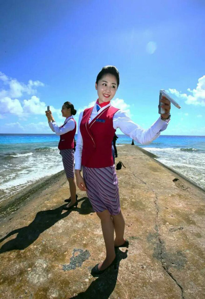 Chinese stewardess celebrate test flight at Nansha Islands airfield