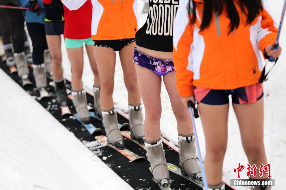 Beautiful skiers wear shorts in snow to mark the No Pants Day