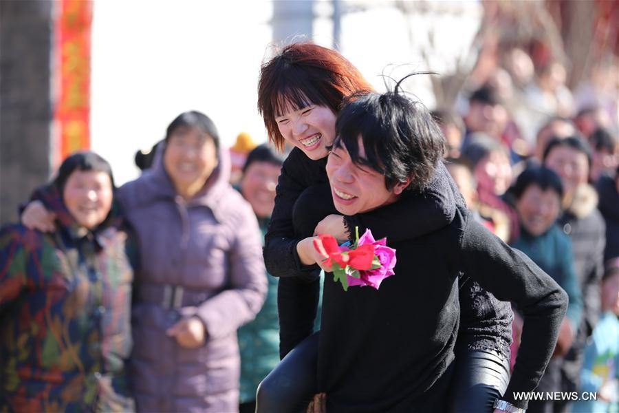 Wife-carrying contest held during celebrations in C China