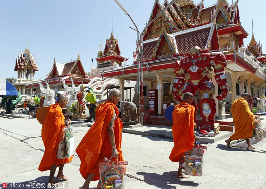 Buddhist temple sets up superhero figures to attract young visitors