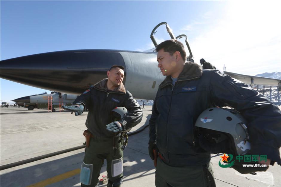 Uygur pilots of PLA Air Force fly over snow-capped mountains