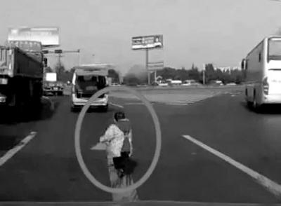 Boy saved after falling out of car on busy highway